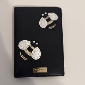 kate spade black passport cover with bee appliqués